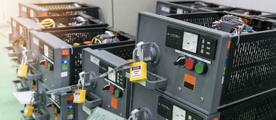 Five stacks of electrical switchgear panels prepared for maintenance.