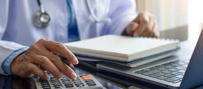Man using a calculator