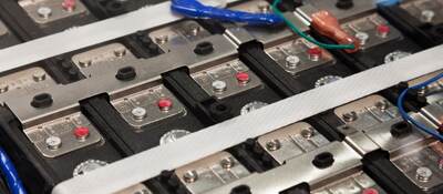 Lab tech working on electronic device