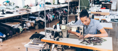 Tailor working in clothing factory