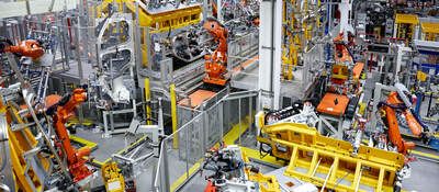 Robots putting cars together in a factory
