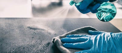 Cleaning table with spray and gloves
