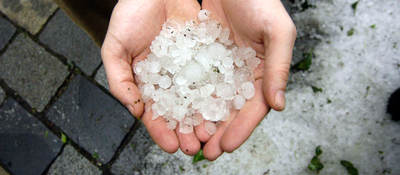 Two hands holding hail stones