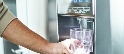 Filling a class with water from a refrigerator 