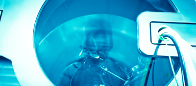 A close up view of a piece of industrial equipment using UV sterilization.