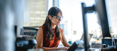businesswoman using a laptop computer at office