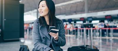 woman with luggage in the airport