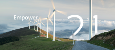 wind turbines in open green hills with text Empower and 21