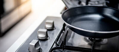 Black pots on a gas stove