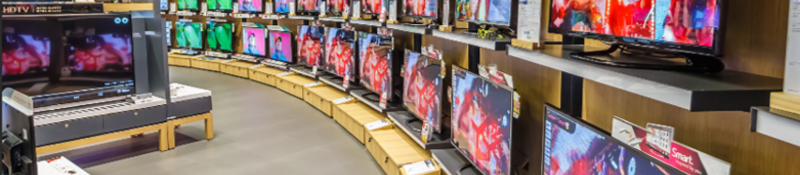 A wall of TVs in an electronics store. 