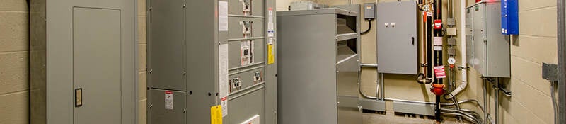 An electricalroom with circuit breakers.