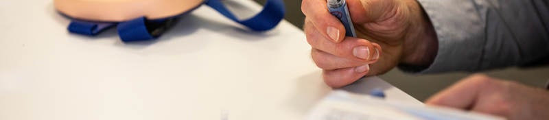 Practitioner holding injection product