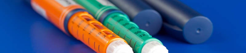 image of colorful syringes used for dispensing pharmaceuticals