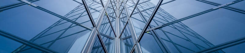 Modern blue glass building mirror reflections