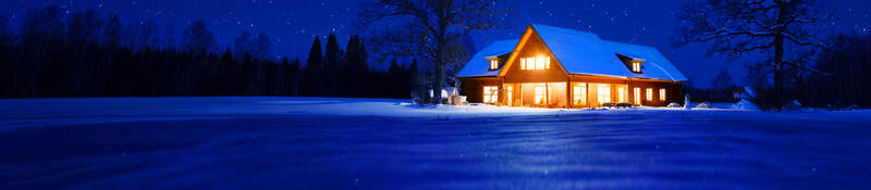 Residential home, lit up at night