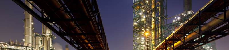 Pipelines at refinery at night
