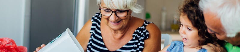 Grandparents sort recyclables with their grandchild