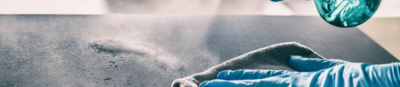 Cleaning table with spray and gloves