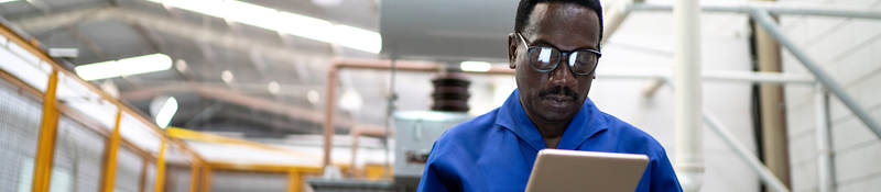 Factory worker using a tablet