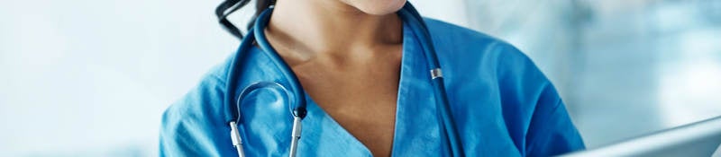 Nurse looking at a tablet