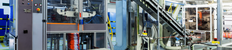 Industrial machinery and systems at a manufacturing facility