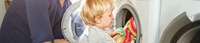 Father and son doing laundry