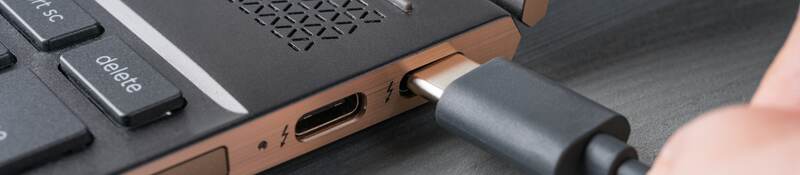 USB Type-C® grey cable being connected to a laptop.