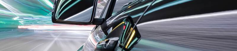 exterior car with light stripes wizzing by