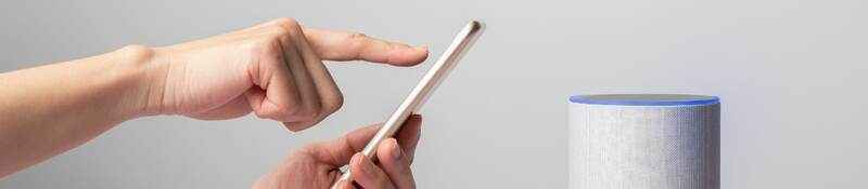user with smart phone and wireless speaker