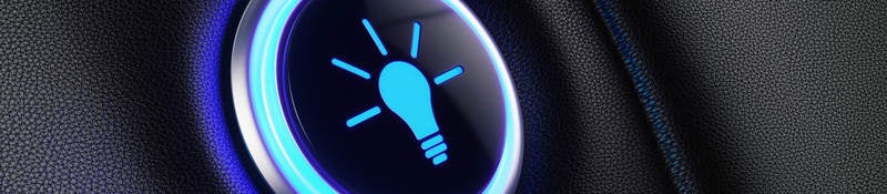 Image of a button with lightbulb icon glowing blue.