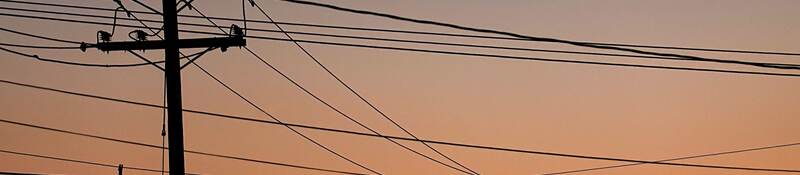Electric poles at sunset.