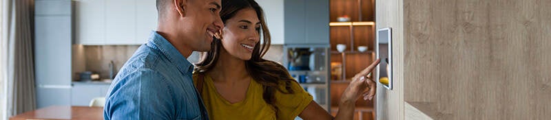 Couple programing their smart home device