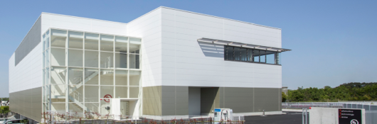 Modern white building with glass front. UL's ATC division in Japan.
