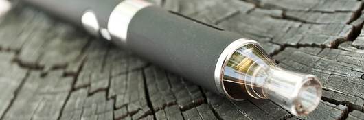 closeup of black e-cigarette on wooden background