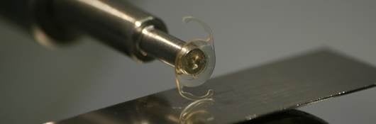 intraocular lens on metal testing machine