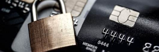 credit card with a closed gold lock laying on top of it