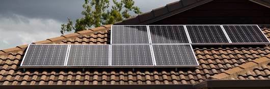 solar photovoltaic panels installed on tiled roof, 