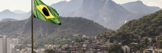 View of Brazil and waving Brazilian flag	