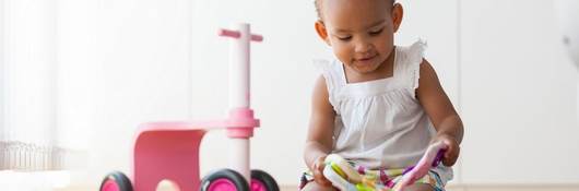 little toddler playing with toys