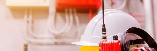 Standard construction safety equipment in a control room.