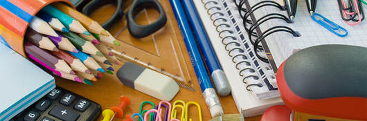 Assorted office supplies, notebooks, pencils