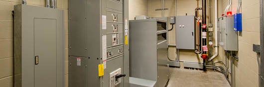 An electricalroom with circuit breakers.
