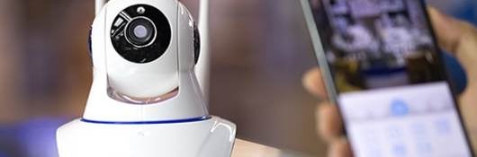 Small webcam with cell phone in foreground