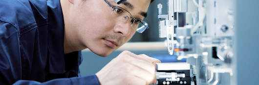 Man looking at test instrument