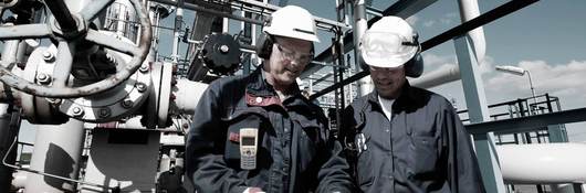 Oil and gas workers confer inside large refinery industry