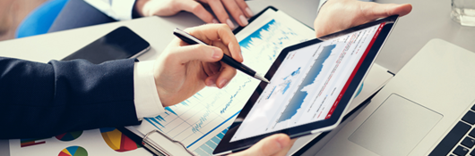 Image of two people’s hands holding a tablet, displaying Connect Analytics for Product iQ