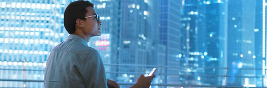 Guy on a roof with a smartphone