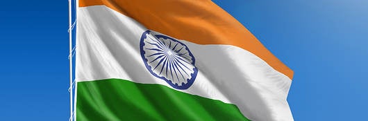 Flag of India against blue sky 