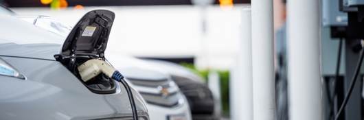 Electric vehicle recharging at charging station
