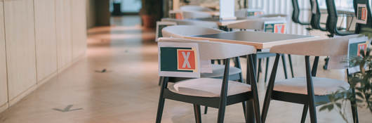 Safe workplace with socially distanced tables